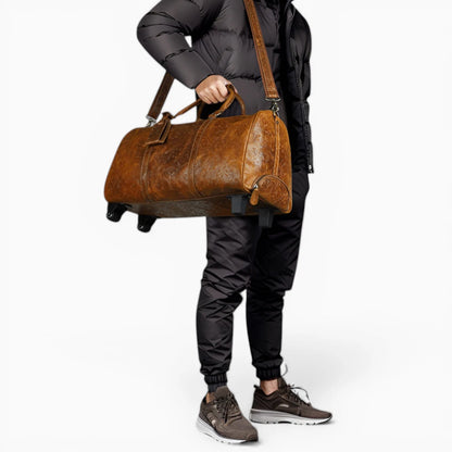 Sac de voyage en cuir à roulettes Élégance Cuir, modèle Cannes, avec finition élégante et poignées confortables.