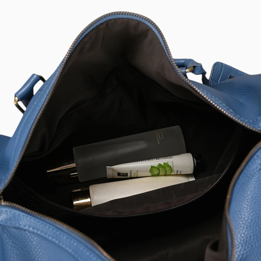 Élégance Cuir sac de voyage en cuir élégant modèle Genève, avec finition soignée et design chic.