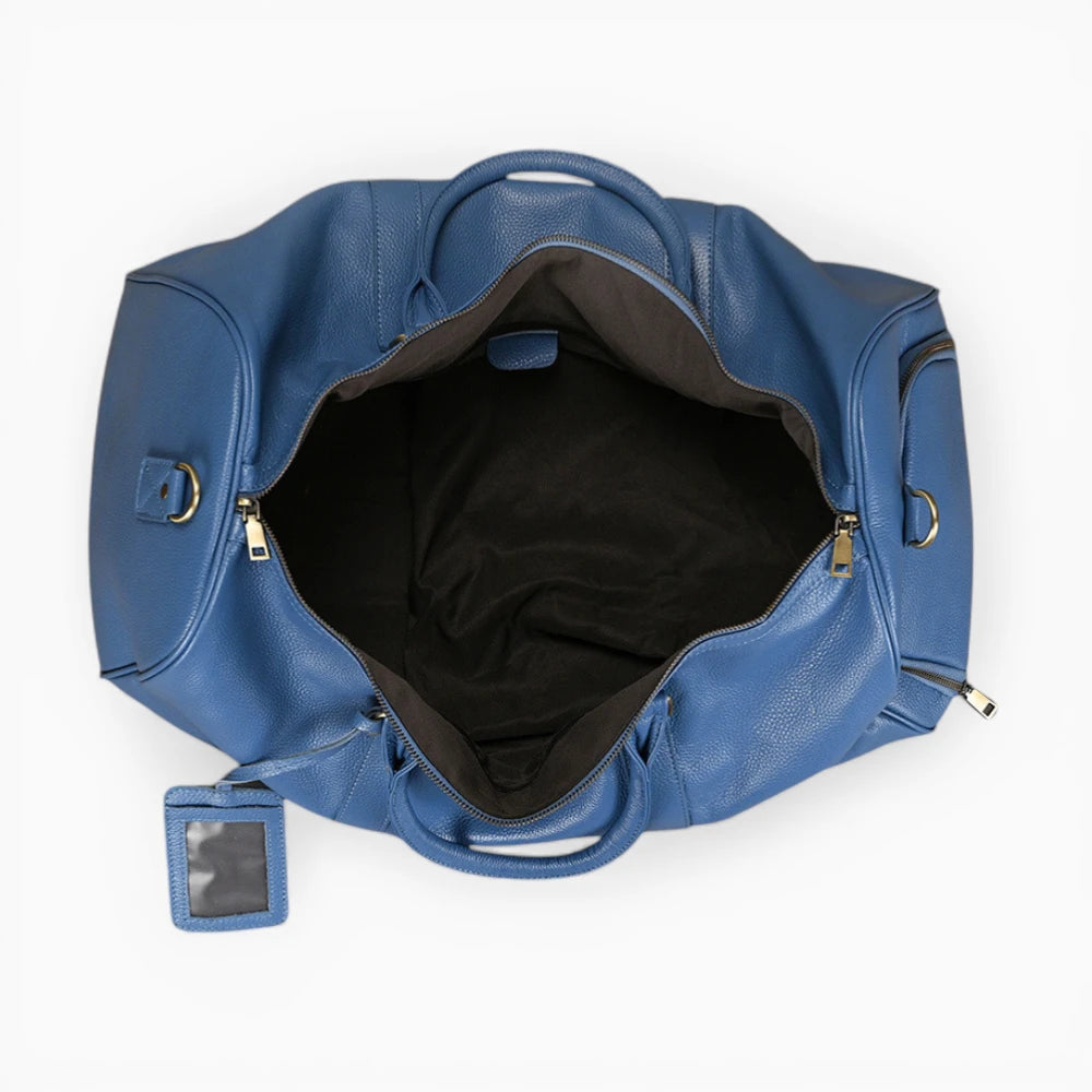 Élégant sac de voyage en cuir modèle Genève, avec finitions raffinées et design sophistiqué.