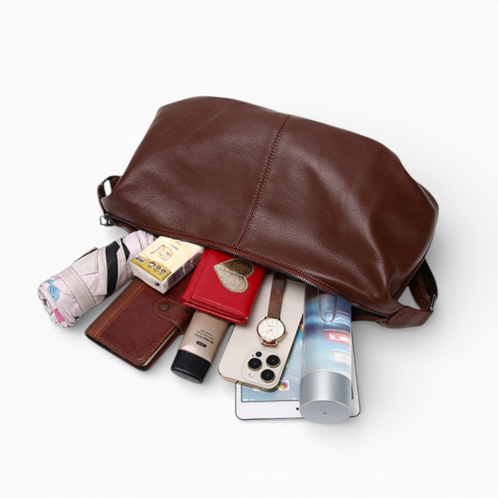 Large leather fanny pack for women, Rubis model by Élégance Cuir, showcasing its opening and spacious interior.