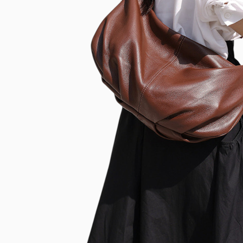 Large brown leather fanny pack for women, Rubis model by Élégance Cuir, displayed on a mannequin.