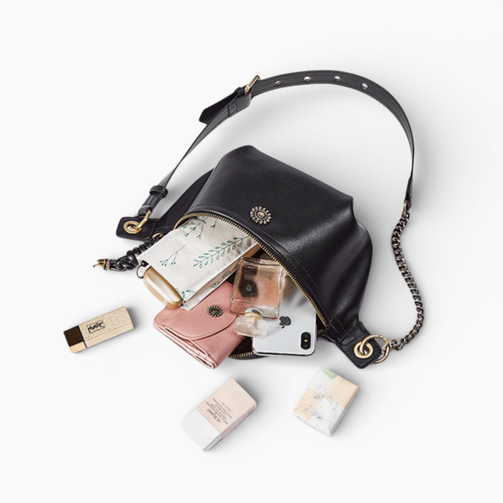 Chic leather fanny pack for women in emerald green by Élégance Cuir, featuring a stylish interior view.