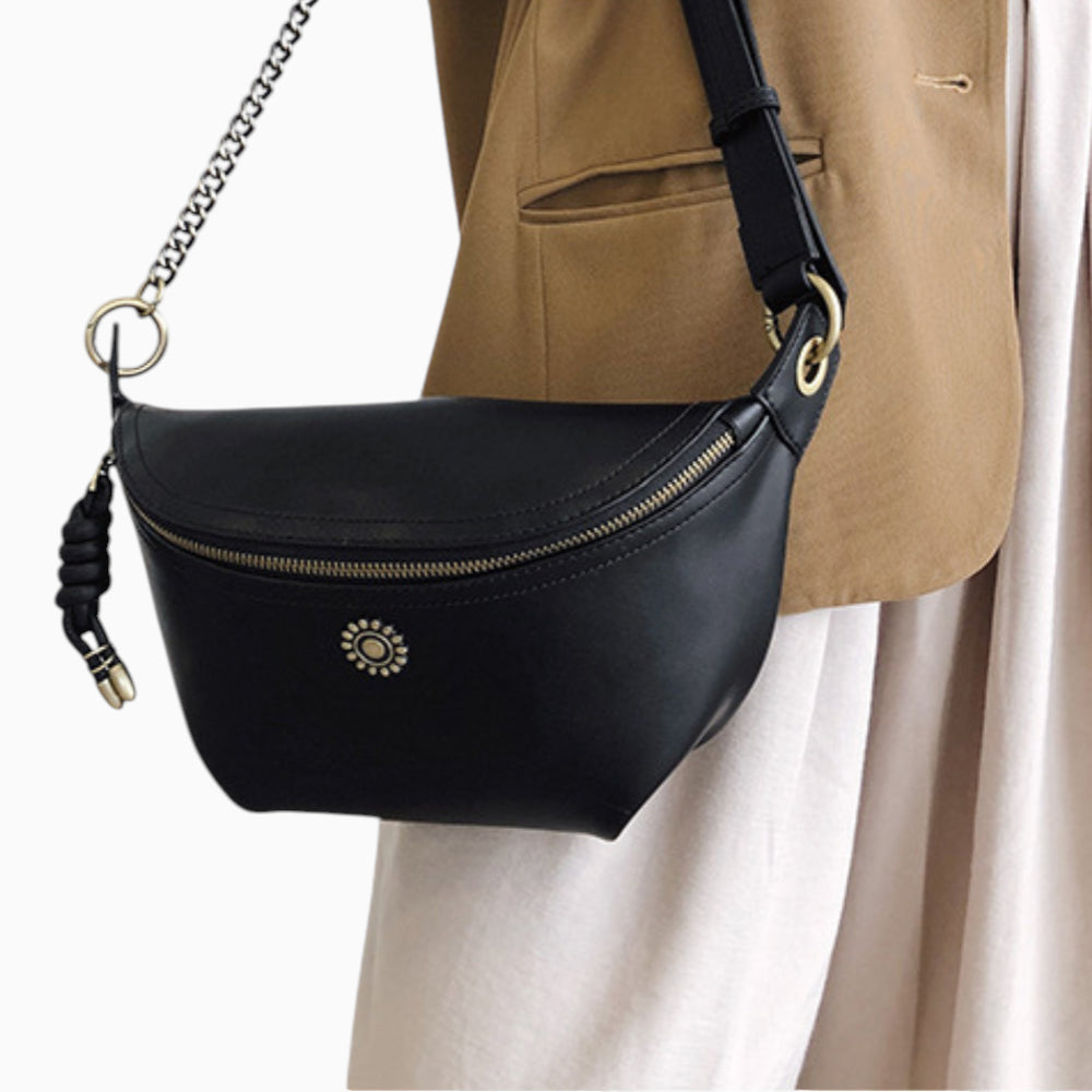 Chic Émeraude leather fanny pack for women by Élégance Cuir, worn across the body with a stylish design.