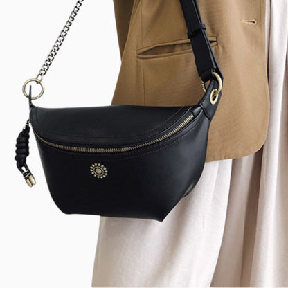 Chic Émeraude leather fanny pack for women by Élégance Cuir, worn across the body with a stylish design.