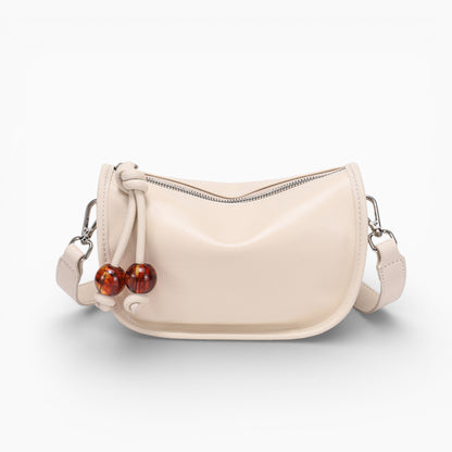 Sac bandoulière en cuir blanc cassé pour femme, modèle compact horizontal Manon d'Élégance Cuir, vu de face.